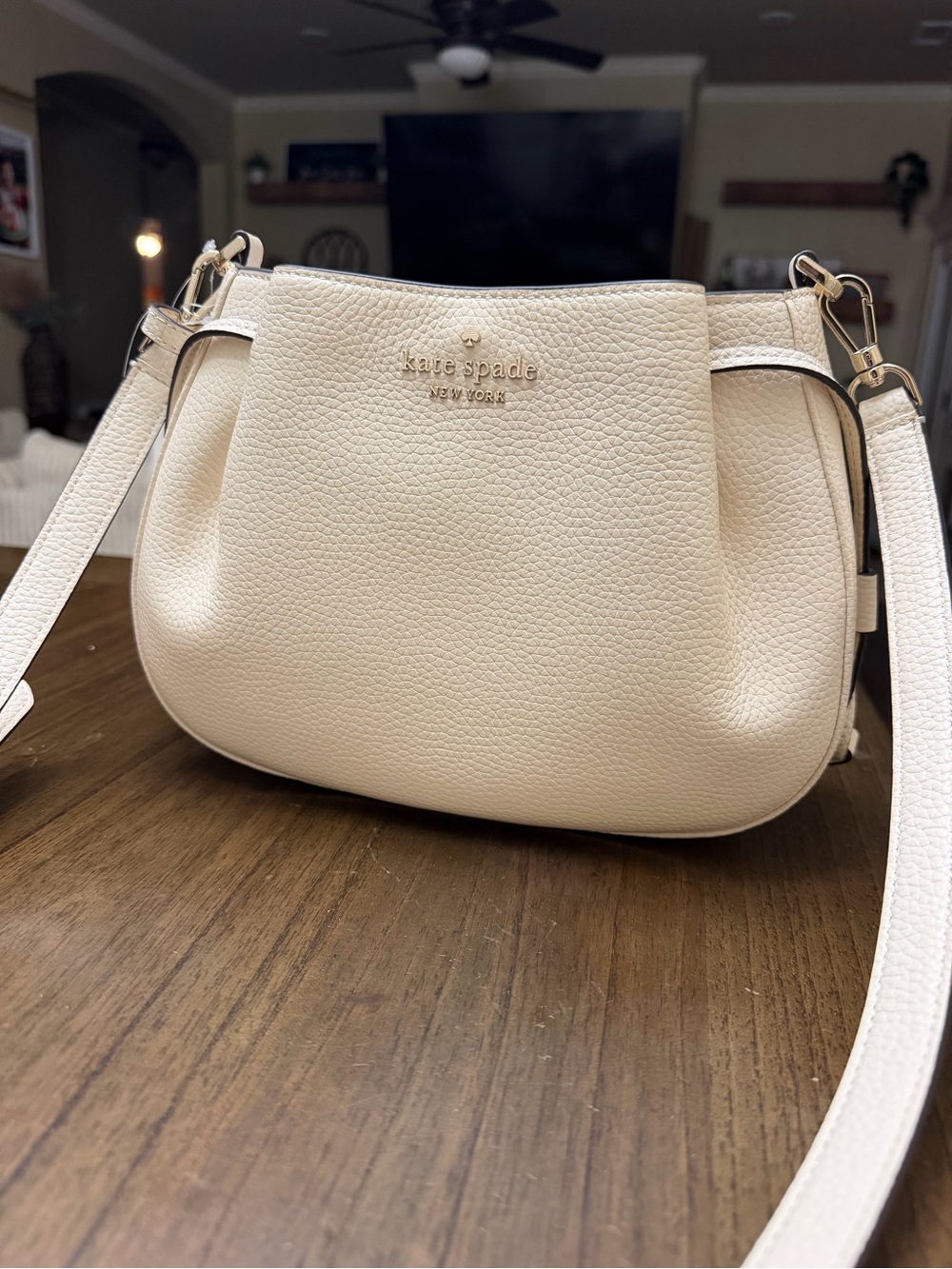 kate spade cream pebbled leather small crossbody with gold logo
